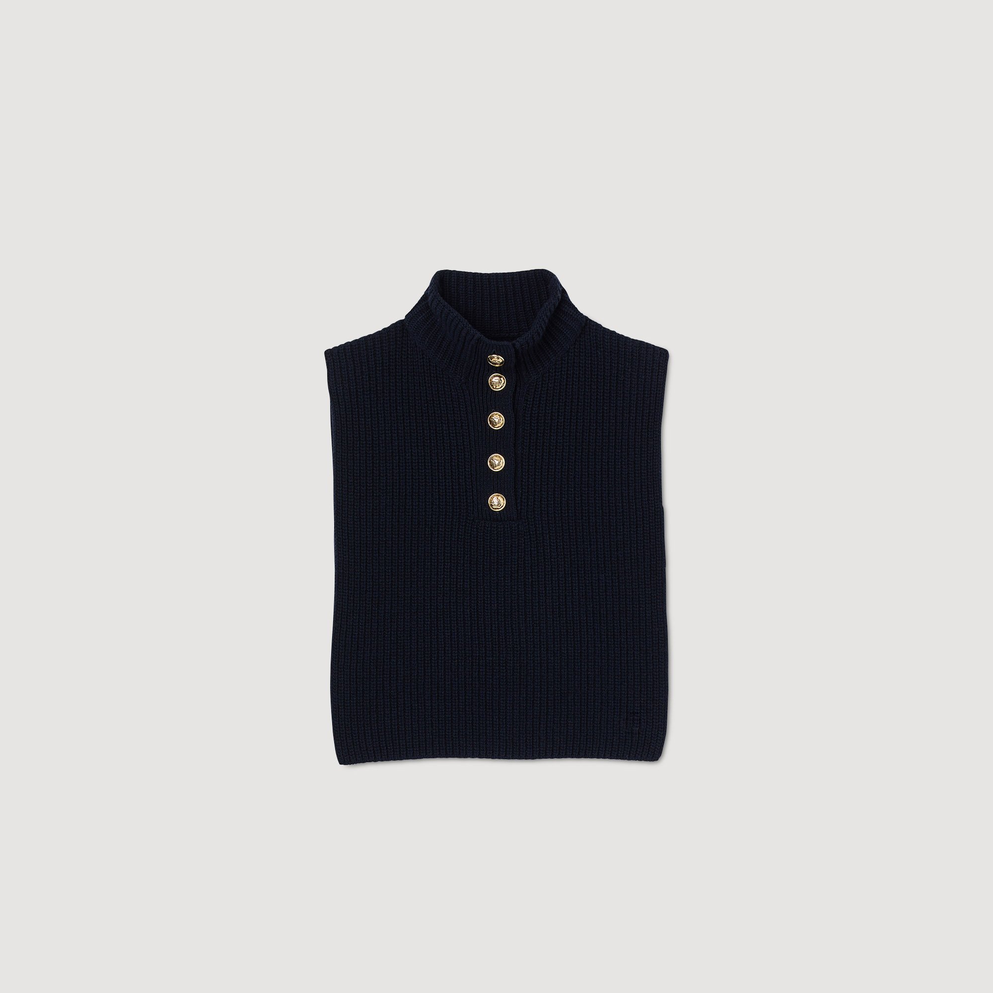 Folded navy blue knit sweater with gold buttons