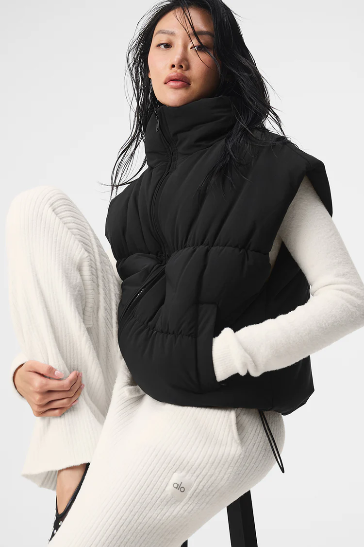 W4583R_01_b1_s1_a1_1_m54_750x Woman wearing black puffer vest and white knit pants