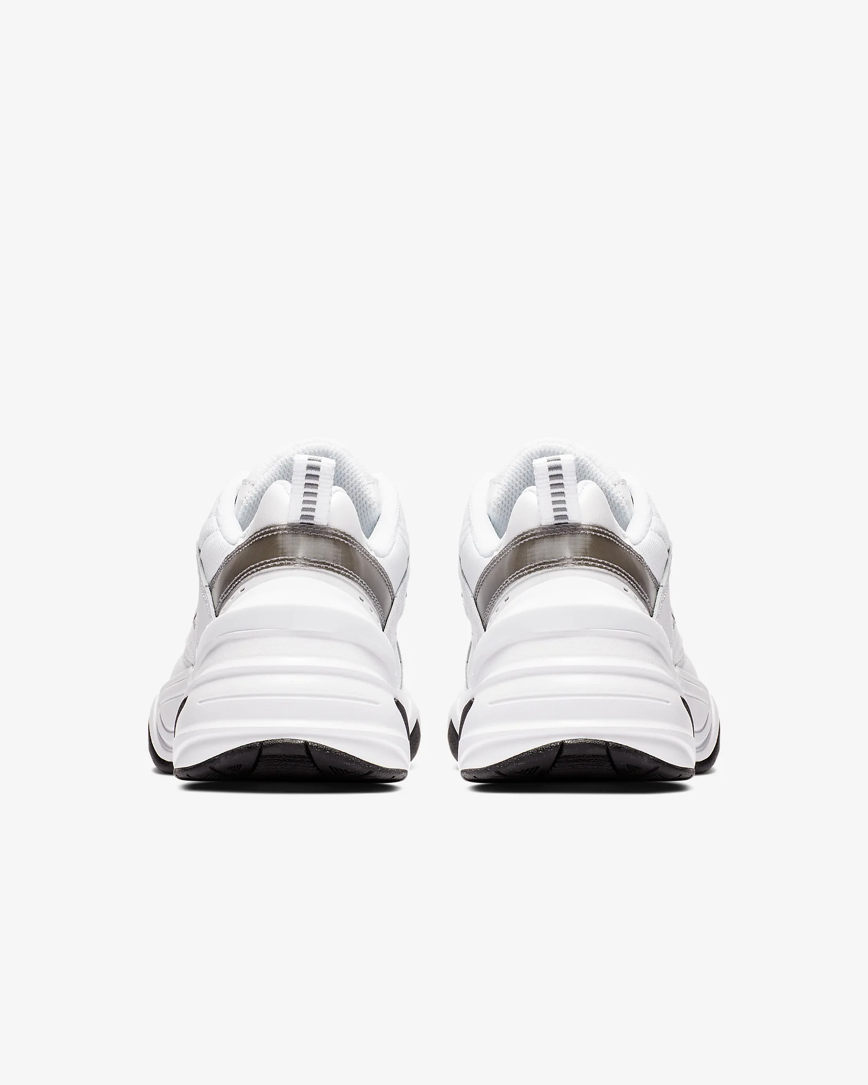 W+NIKE+M2K+TEKNO (2) Rear view of white athletic shoes with black soles