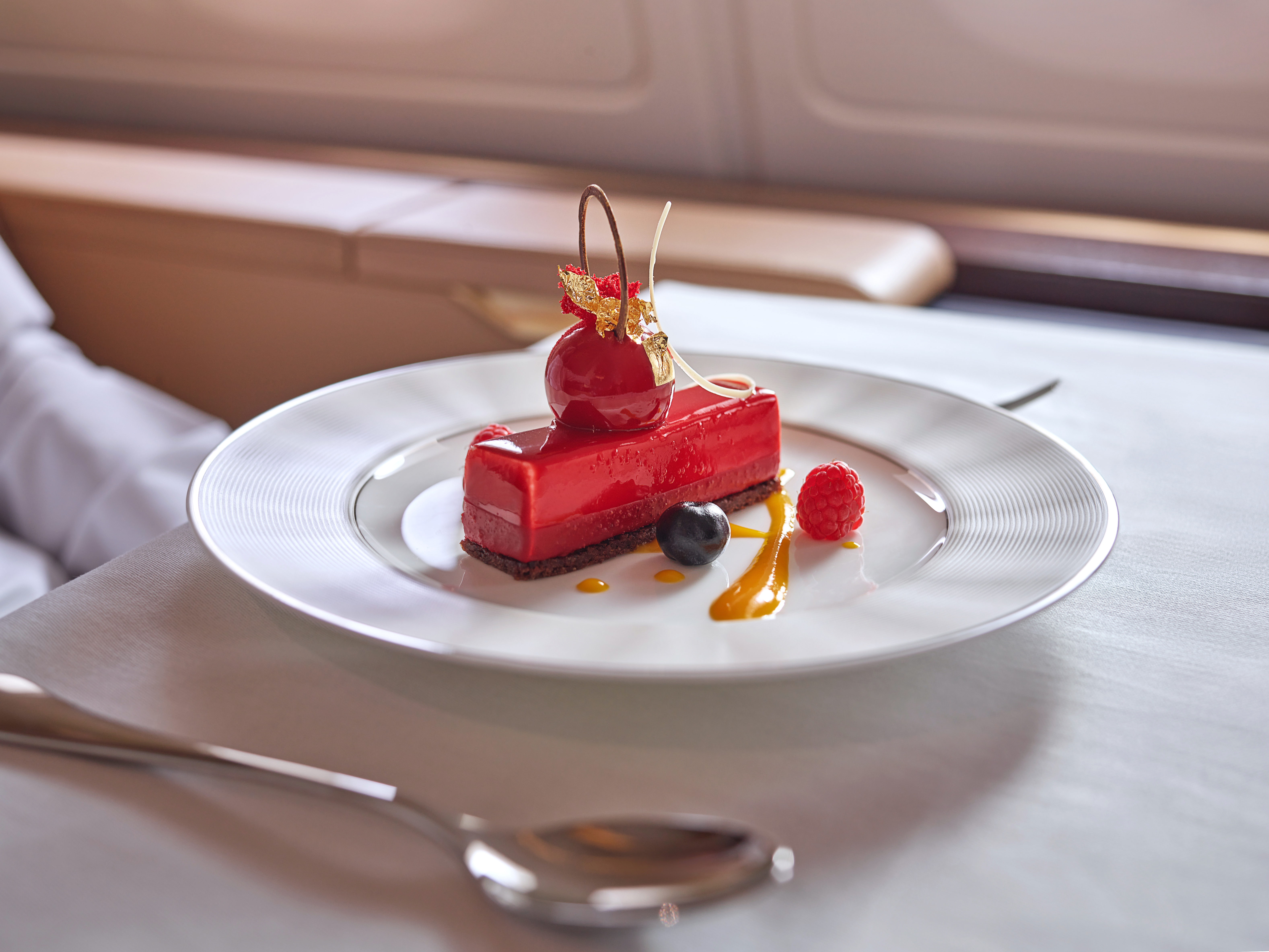 Elegant red dessert with berries and sauce
