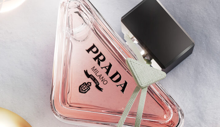 Triangular pink Prada perfume bottle with black cap