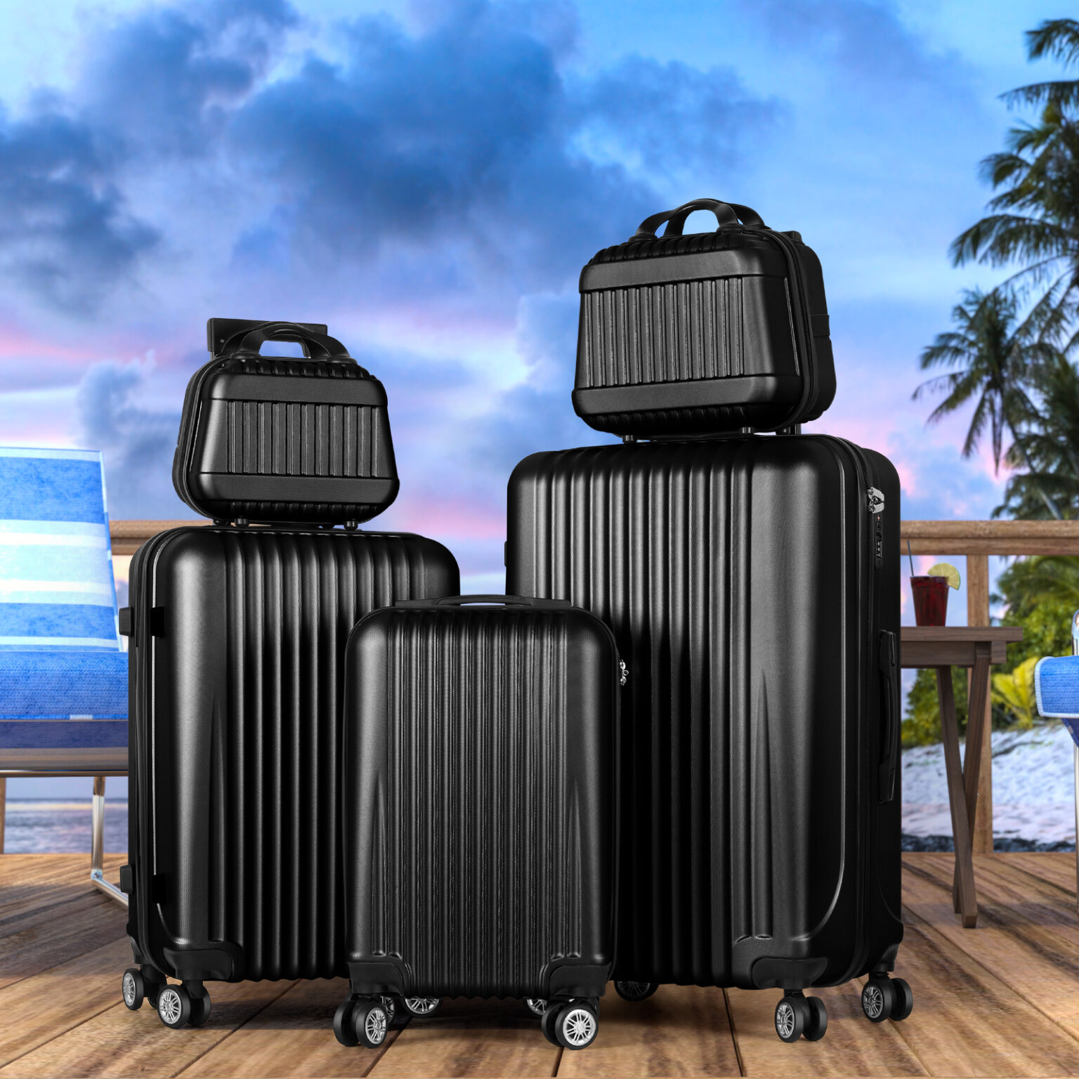 Set of black luggage on wooden deck with tropical background