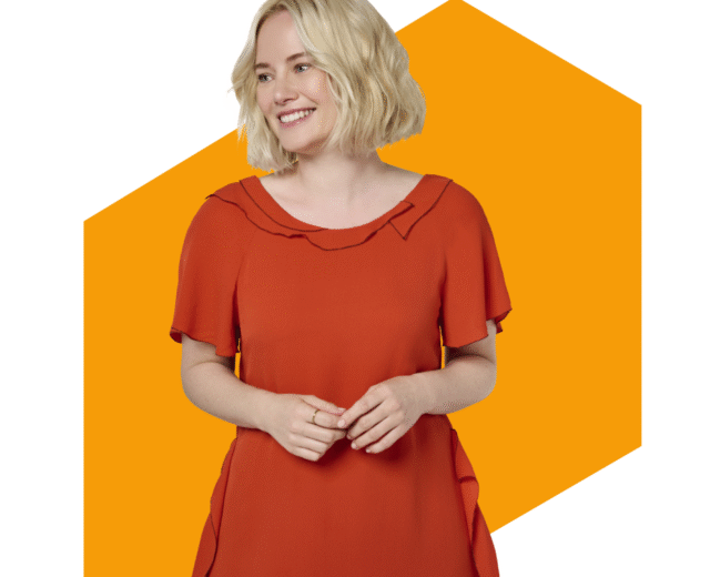 Smiling woman in orange dress with blonde hair