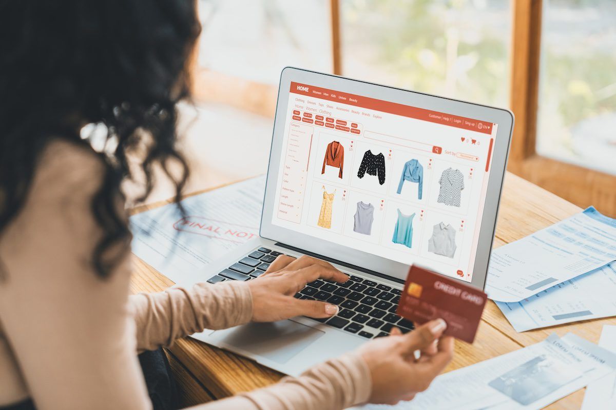 Woman shopping online with credit card